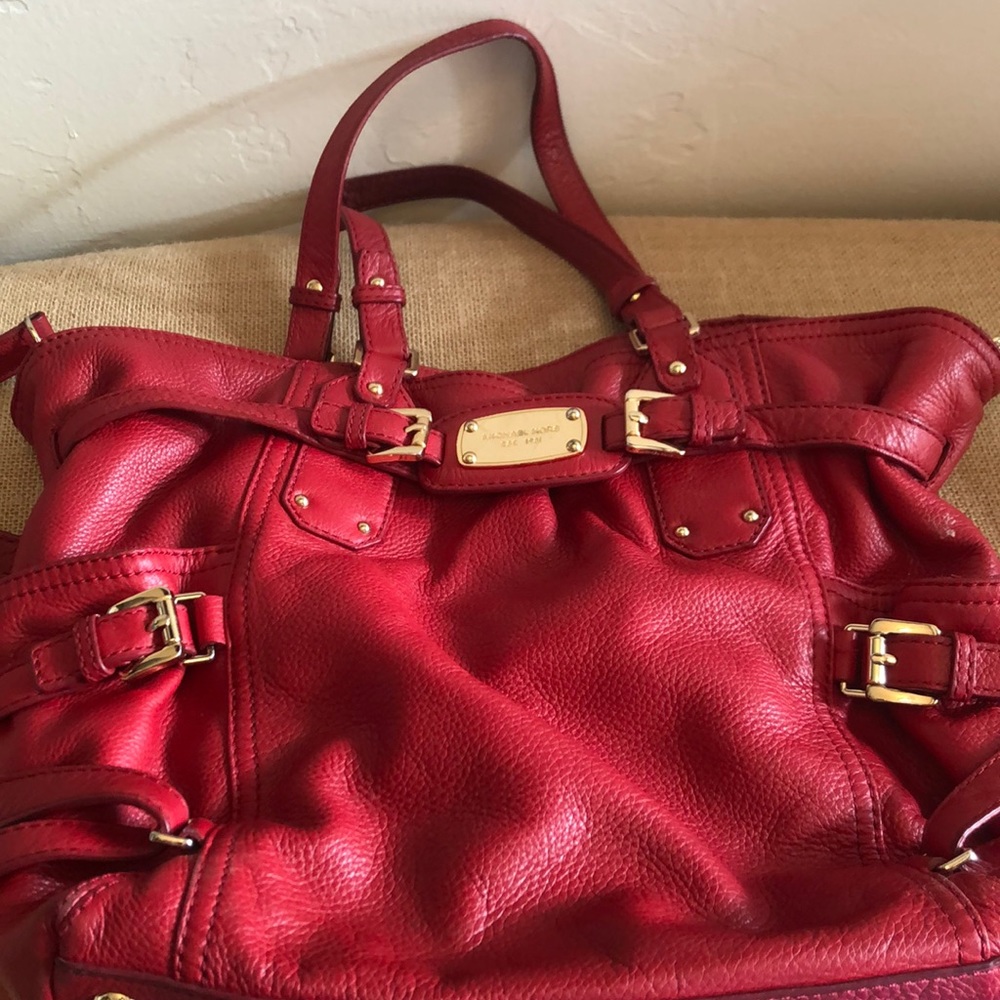 Michael Kors large red leather purse.
